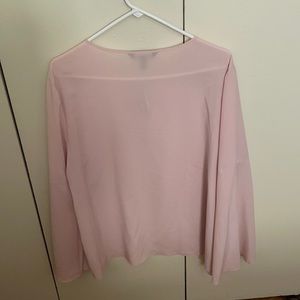 The blouse is a vintage petal color